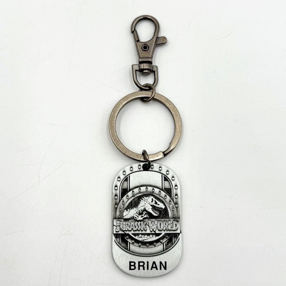 Universal Studios Jurassic World T-Rex Dinosaur Metal Keychain Name Brian